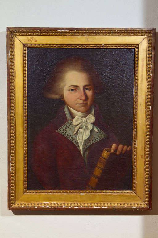 A late 18th century oil on canvas portrait of a gentleman holding a philosophy book; probably German.  No discernible signature.  Canvas measures 21.5