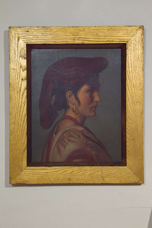 An early 19th century oil portrait on board of an Italian woman in traditional costume. Framed in oak with gold leaf. Board measures 21 in. x 17 in.