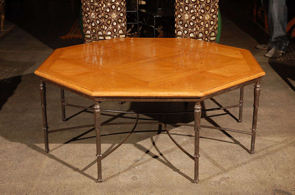 Elegant French Octagonal oak Parquetry Coffee Table.<br />
Superior build quality on a cast iron base.<br />
<br />
Mid Century Art Deco Style Iron work,but the table is probably from the 1960's 1970's.<br />
<br />
Mosaik provides Antiques,