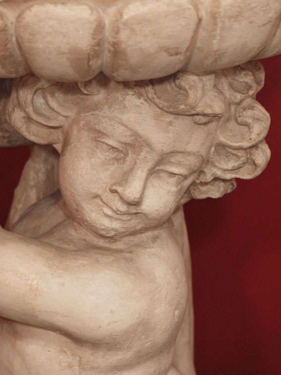 C 1910 Italian Cast-Stone Planter Shaped as a Draped Putti Holding a Large Bowl
