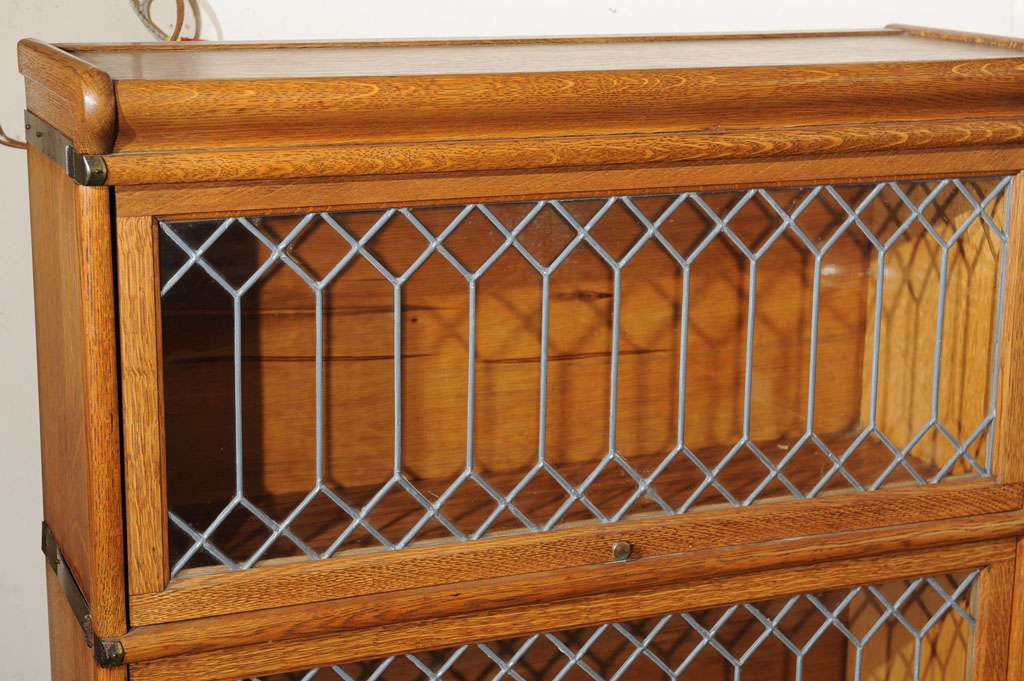 Four Section Oak Lawyer's Bookcase with Leaded Glass Doors at 1stDibs