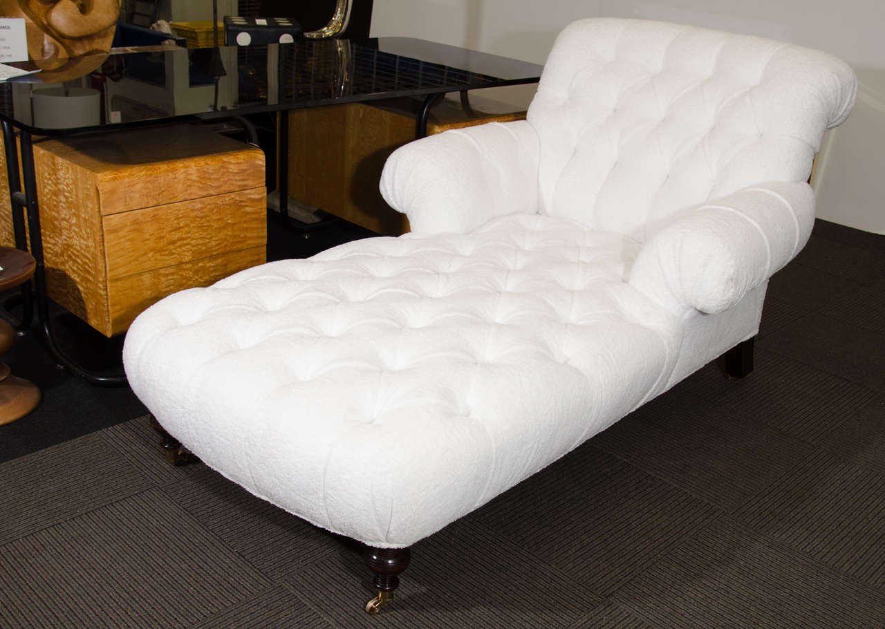 Striking and Amazingly Comfortable White Button tufted Recamier or Chaise Lounge upholsrered Unusually in Terrycloth with Turned Finial Cherry Wooden legs and Solid Brass Wheels.

.