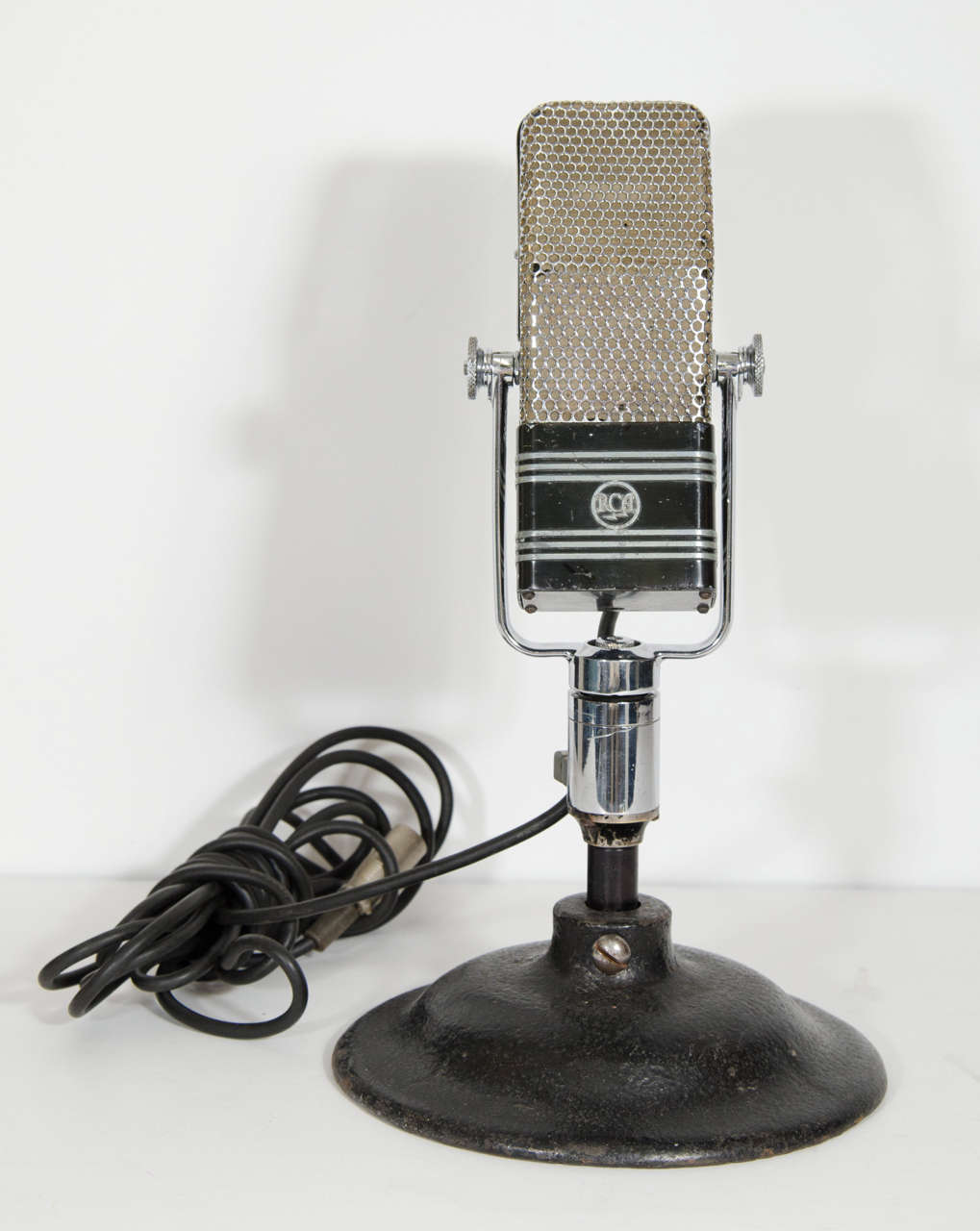 A vintage 44-BX RCA ribbon bi-directional velocity microphone designed for broadcast studio use. Good vintage condition with age appropriate wear and patina. The microphone is in working condition.