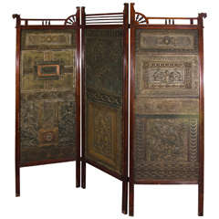 An Aesthetic Movement Carved Wood Three-Part Folding Screen w/Embossed Leather