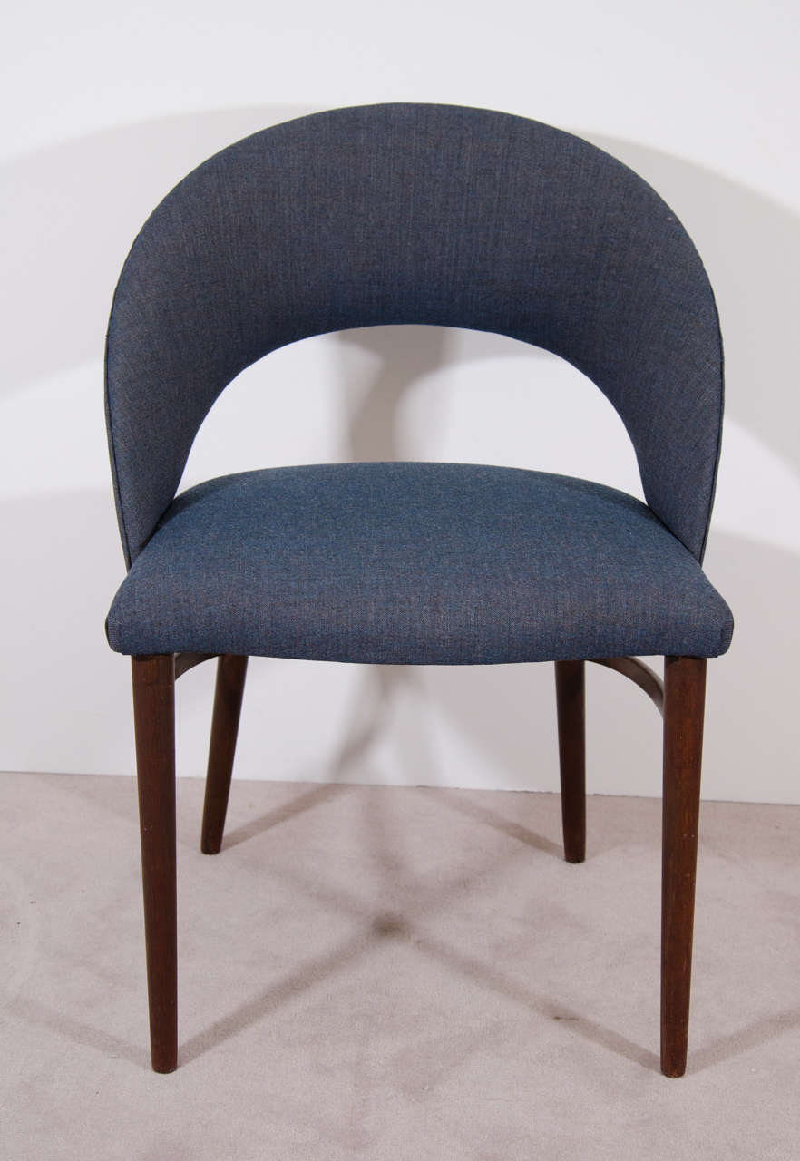 A vintage Frode Holm side chair, with curved top rail and mahogany legs. New upholstery by Kvadrat. Good vintage condition with age appropriate wear. Some minor nicks to wood.

8116