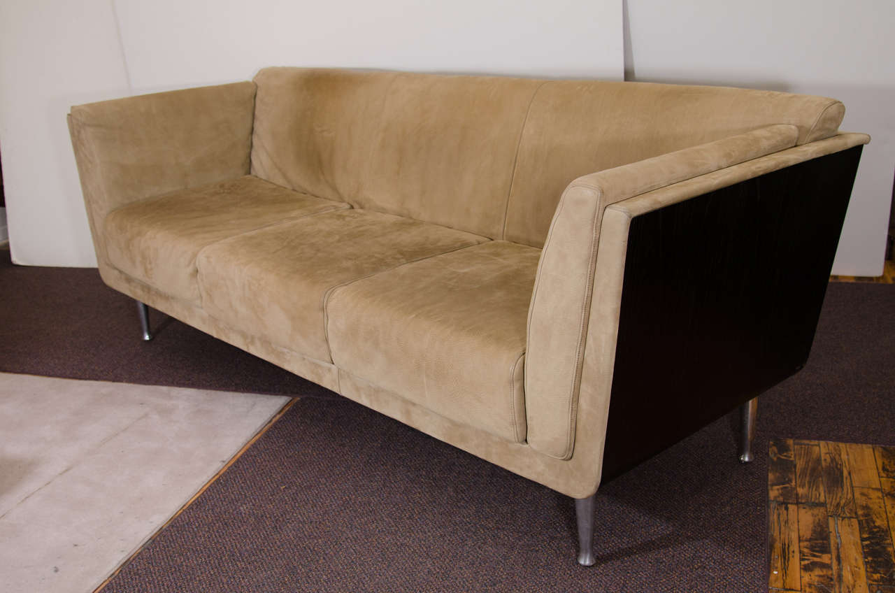 A vintage Herman Miller three-seat sofa with a bentwood frame that has been wrapped inside with leather and exposed chrome legs. Stretched padded back and square pillows all with stitch detailing.

Good vintage condition with age appropriate