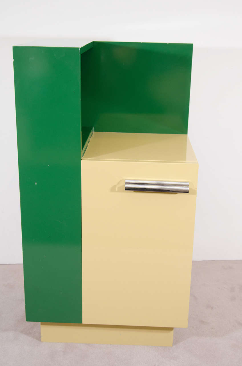 Rare and Great Skyscraper Paul Frankl Lacquered Cubist Side Cabinet in Deep Green and Pale Yellow with Stepped Modernist Chrome Handle.Fantastic Accent Cabinet for a Modern Living Room.Inside Cabinet can Accommodate Several Glass Shelves,with