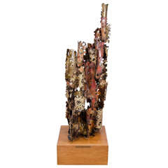 A Brutalist Mixed Metal Sculpture on a Wooden Base by Silas Seandel