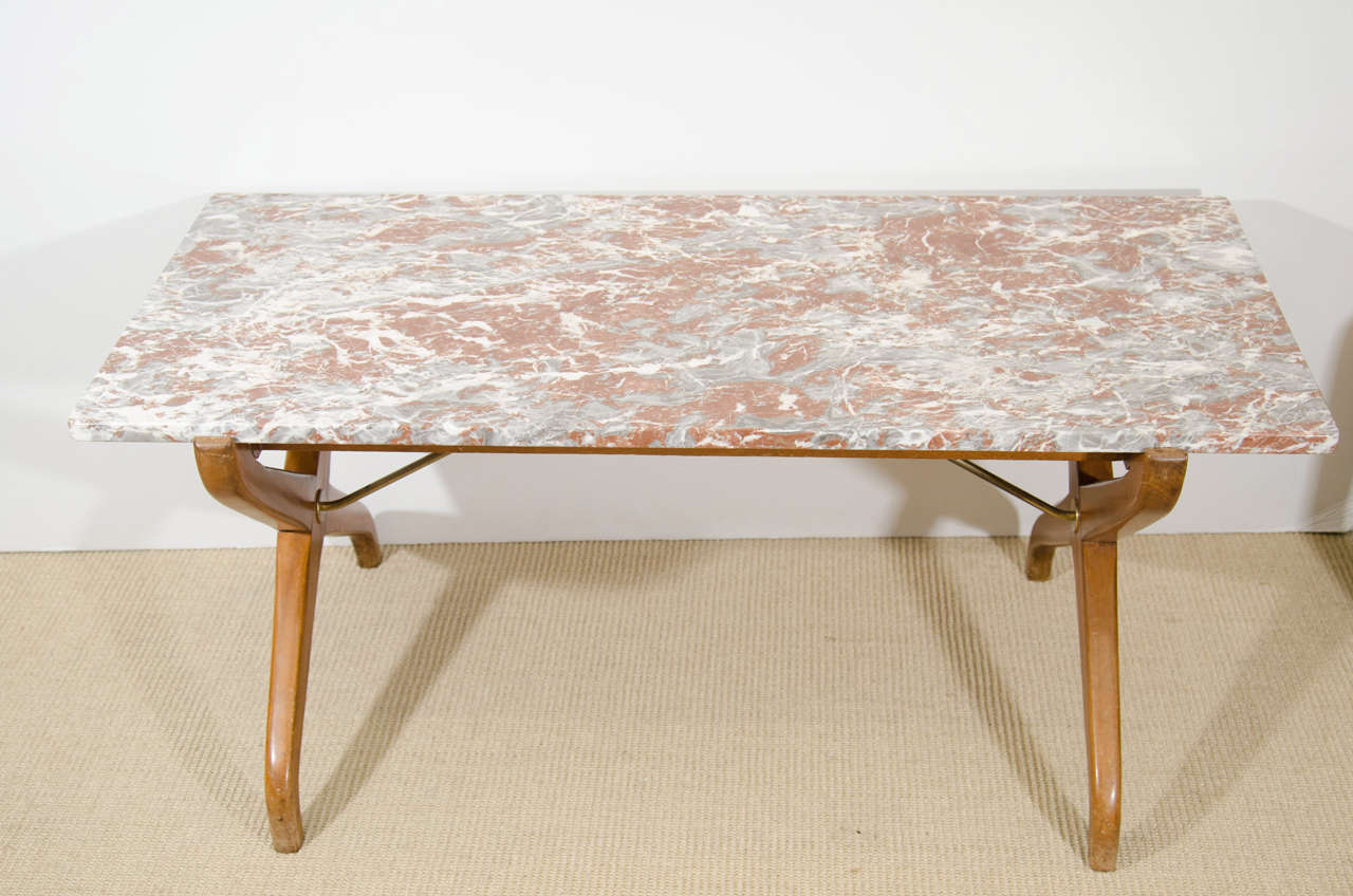 A Scandinavian Modern coffee table by designers Algot P. Torneman & David Rosen with teak legs, brass stretchers and marble top, circa 1950s, Sweden.

Good vintage condition with age appropriate wear. Some scuff marks to wood.