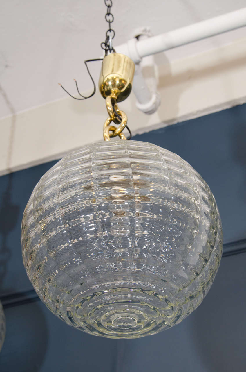 A vintage pair of Venini textured glass globe shaped pendant lights or lanterns, circa 1940s. European socket. Dealer will rewire for additional fee. 

Good vintage with age appropriate wear and patina.