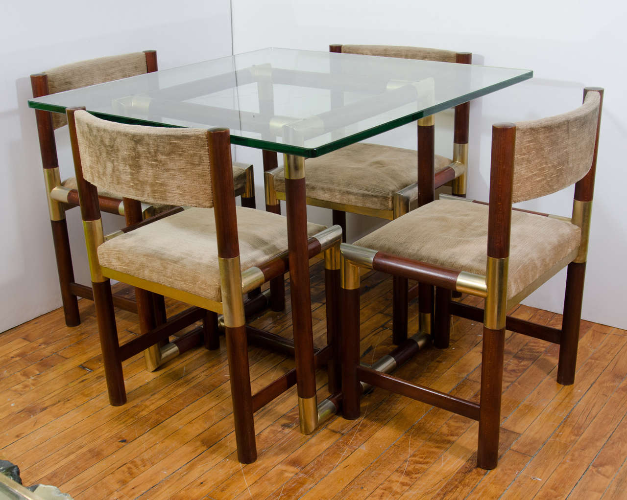 A vintage French small glass dining room table with tubular wood frame, brass accents, and glass top.  Four matching chairs in original mocha colored upholstered.

Good vintage condition with age appropriate wear and patina.  Some scratches and