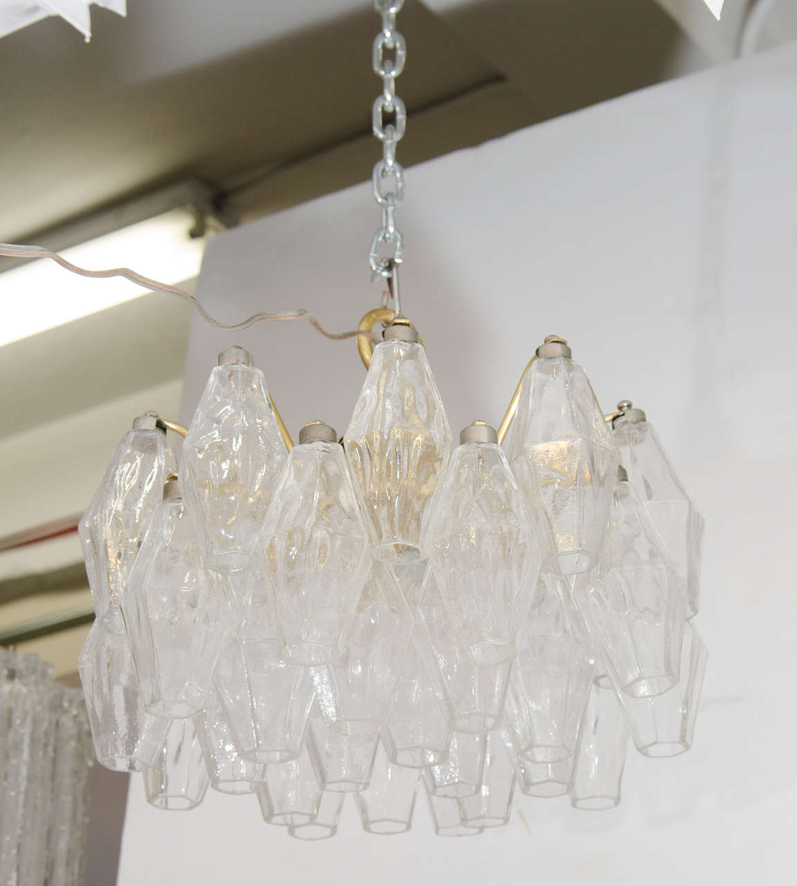 A vintage clear Murano glass Carlo Scarpa for Venini polyhedral chandler, circa 1960s. This chandelier takes two candelabra base bulbs.
