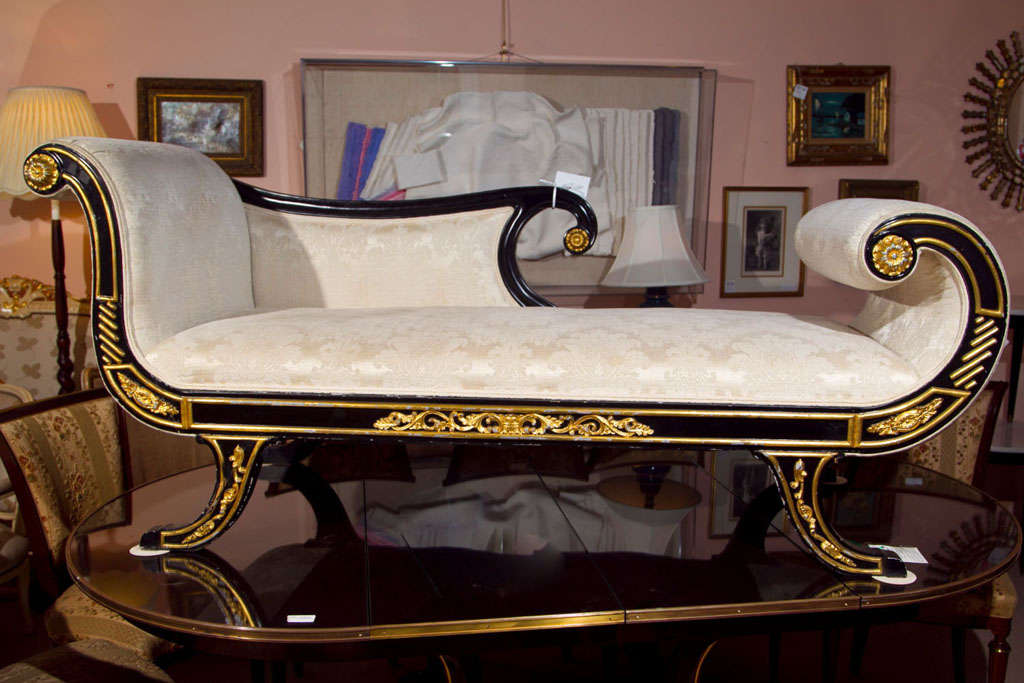 Beautiful Regency style recamier daybed, overall ebonized & parcel-gilt, with scrolled armrests and back, cushioned seat. In the Manner of Maison Jansen.