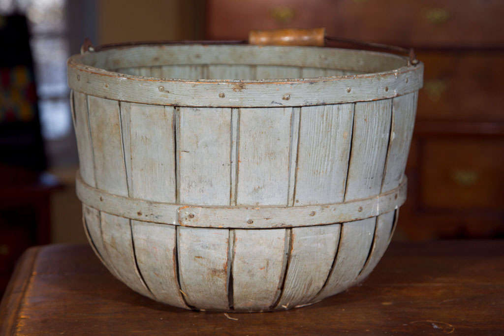 A very nicely sized, strong and functional bluish-grey wooden bucket with metal and worn wooden handle.
