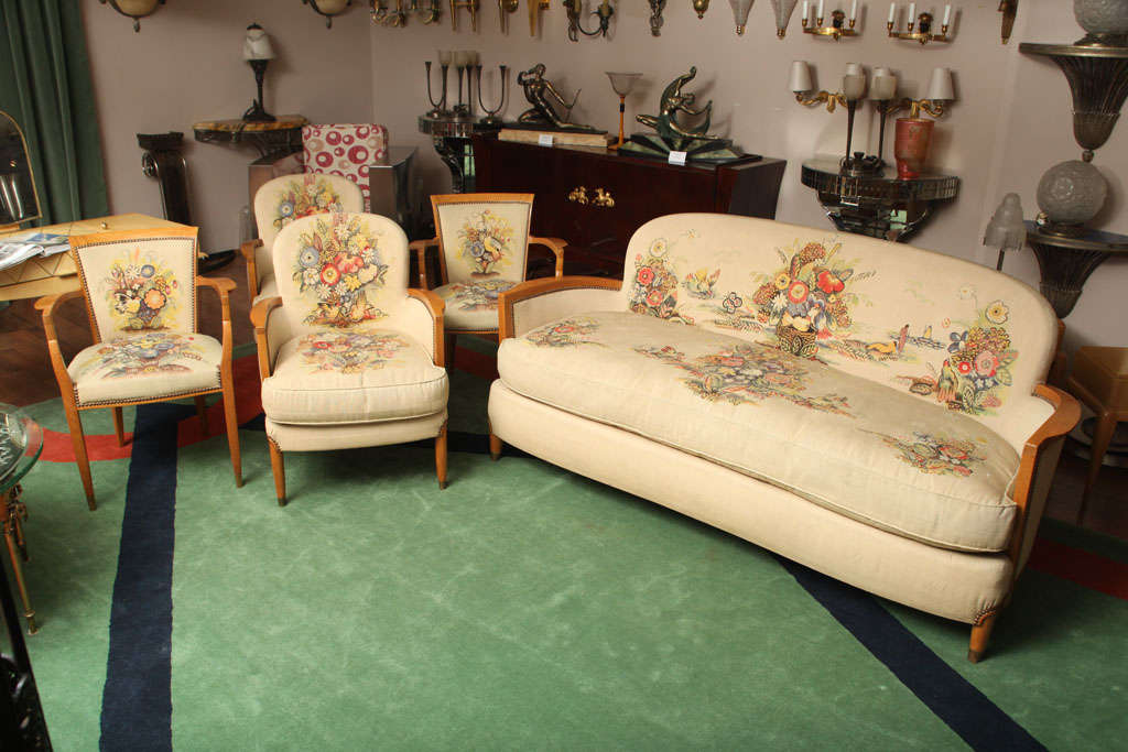 JULES LELEU (1883-1961) <br />
Five –piece set comprising sofa, two club chairs and two armchairs, made of oak wood, with gilt-bronze sabots and upholstered with Aubusson tapestry.<br />
<br />
Ref.  F. Siriex, The House of Leleu, Paris, 2008,