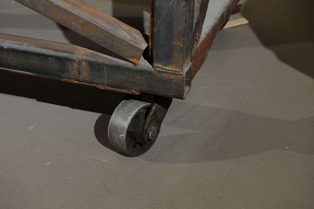19th Century Industrial Steel Encased Redwood Wheeled Table 1