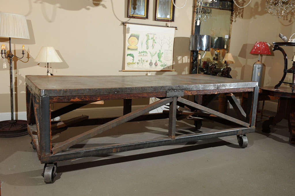A truly exceptional piece of California history, this Redwood and steel work cart was used to transport steel from horse and wagon at 248 Utah Street in San Francisco. The table top is steel over wood panels. The exposed wood legs and armature has