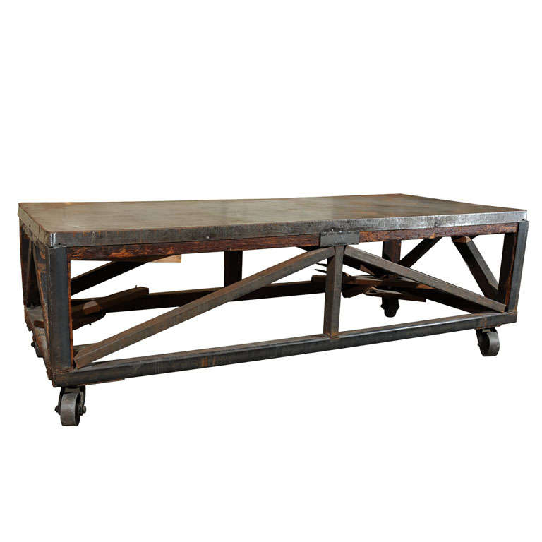 19th Century Industrial Steel Encased Redwood Wheeled Table