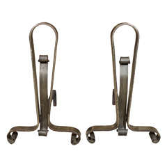 A Pair Of Iron Andirons