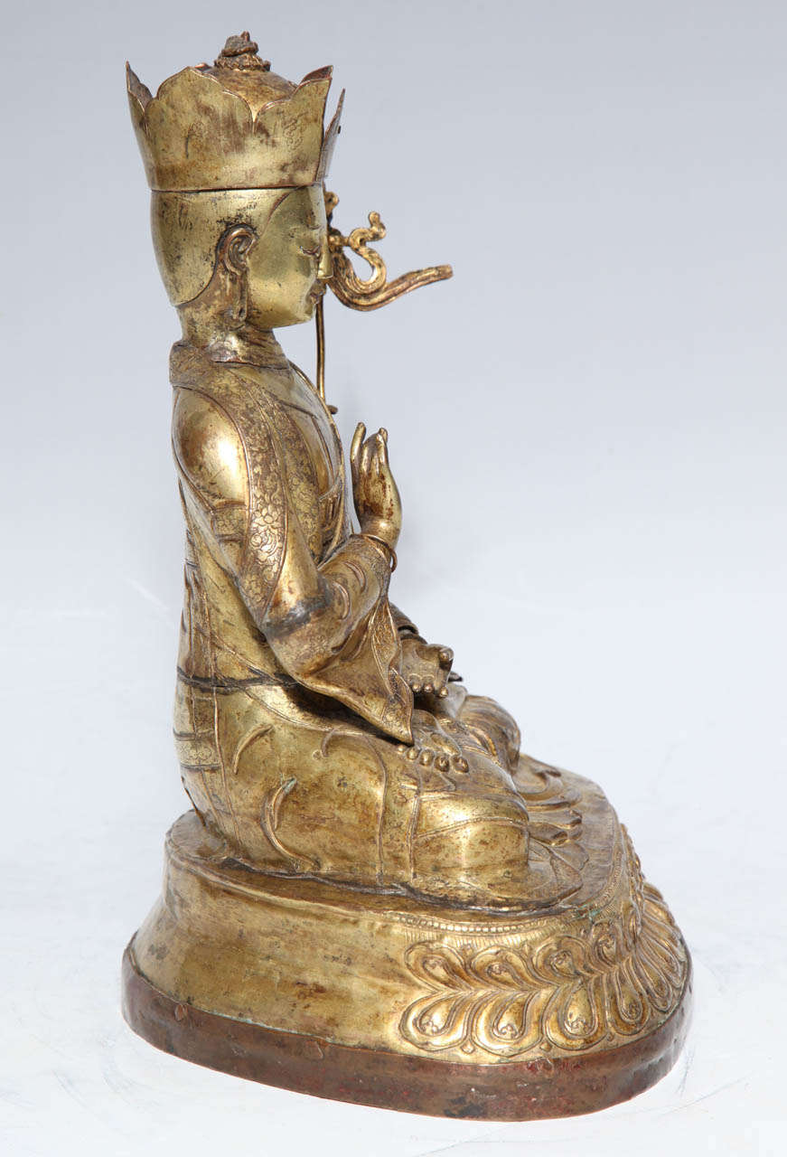 A 17th- 18th Century Tibetan Gilt Bronze Crowned Seated Buddha 1