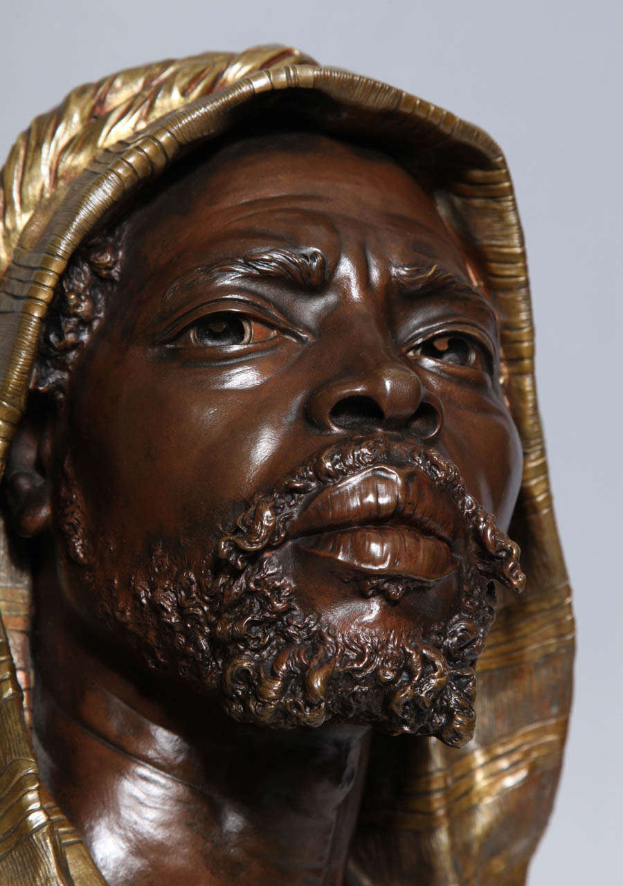 E. Guillemin, (1841-1907) An Antique French Bust of a Nubian in Original Gilt and Patinated Bronze mounted on Rouge Marble Base In Excellent Condition In New York, NY