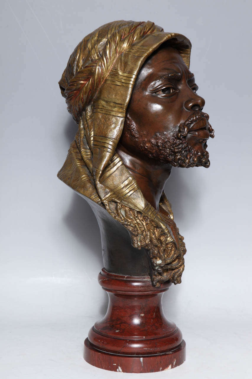 E. Guillemin, (1841-1907) An Antique French Bust of a Nubian in Original Gilt and Patinated Bronze mounted on Rouge Marble Base 2