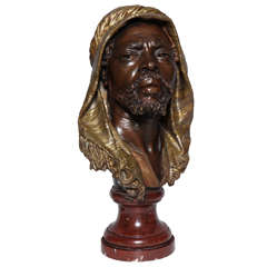 E. Guillemin, (1841-1907) An Antique French Bust of a Nubian in Original Gilt and Patinated Bronze mounted on Rouge Marble Base