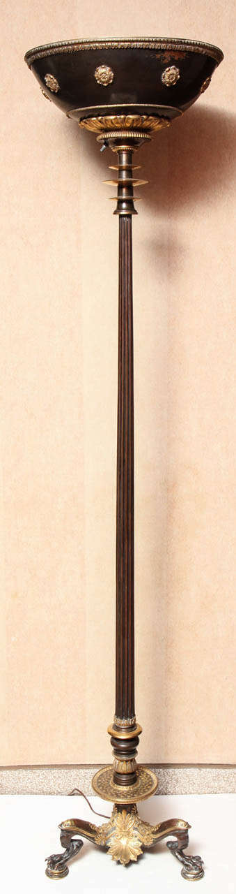 A pair of the finest quality Empire style two-toned bronze torchieres attributed to Caldwell.