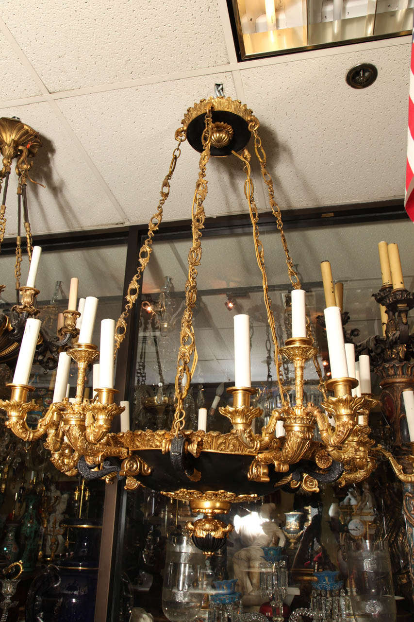A very large 19th Century French Empire style twenty light, two-toned bronze chandelier.
Stock Number: L303