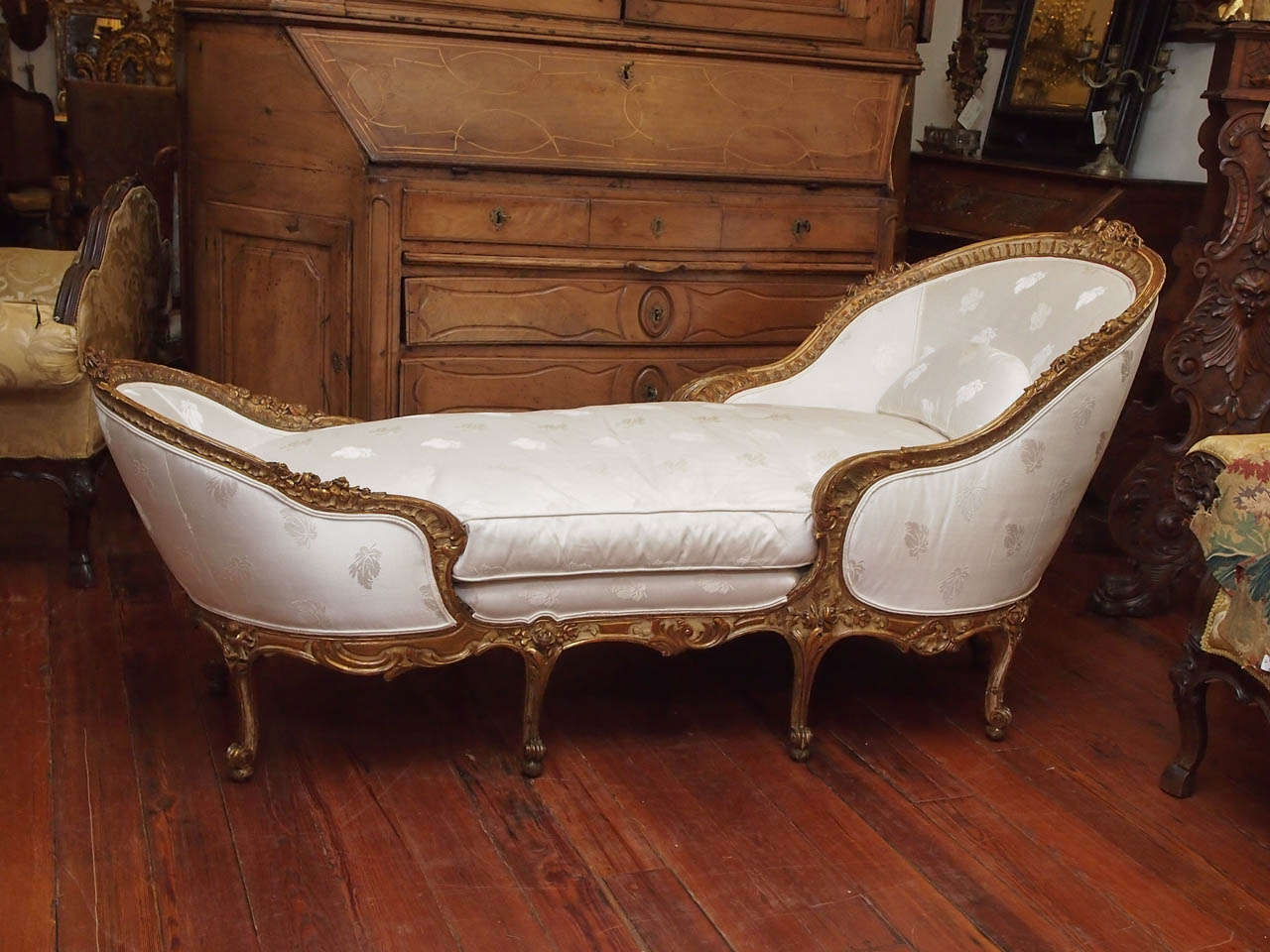 19th century giltwood Louis XV style gondola style chaise longue
exceptional carving.