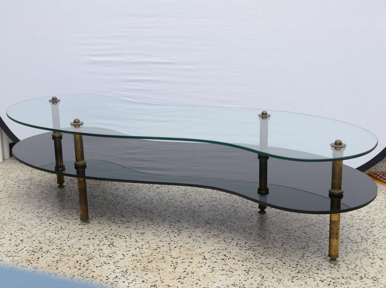 Beautiful curved 2 tiered glass and brass coffee table.  Table is from 1960s Italy.
