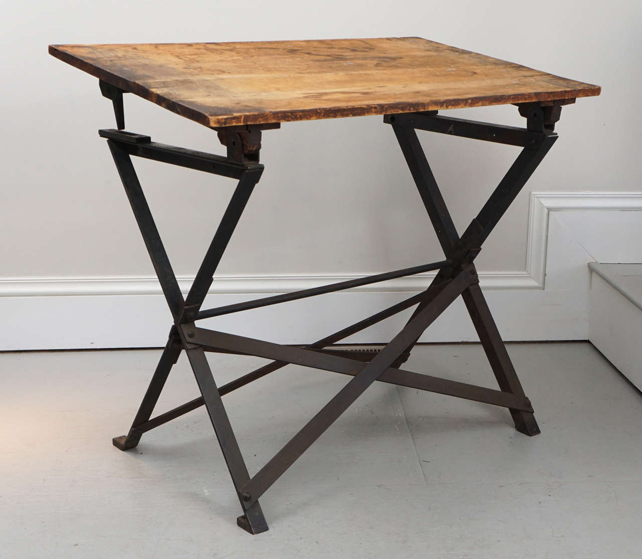 A handsome looking Industrial drafting table. The top adjusts to different angles.