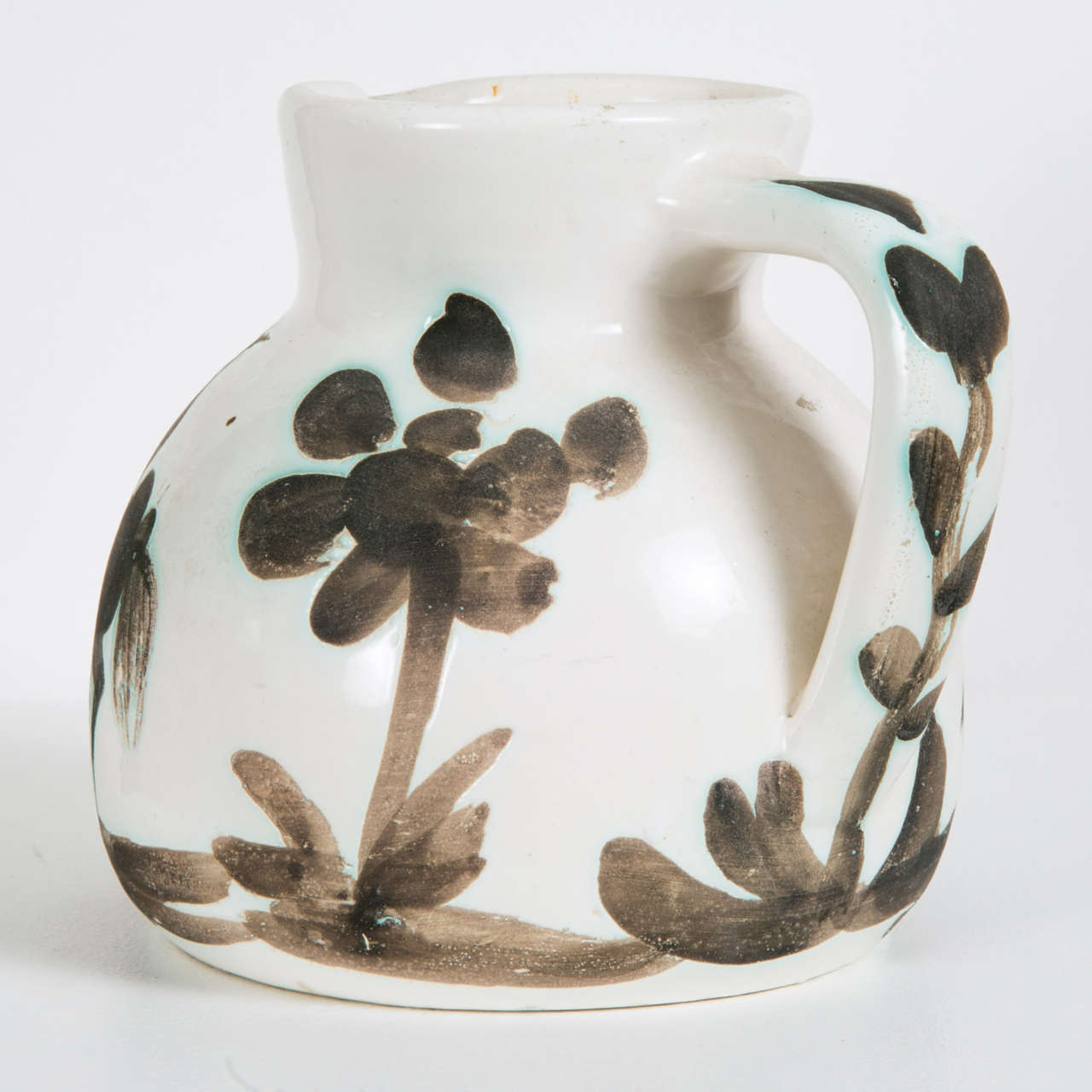 Terre-de-faïence pitcher with oxidized paraffin decoration.
Picasso Edition, Madoura 
Stamped 