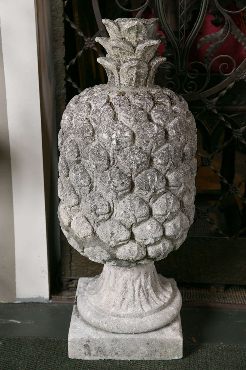 A pair of 18th century carved stone pineapples.