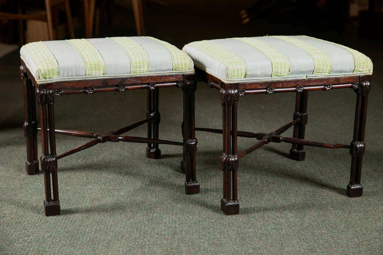 A pair of Chinese Chippendale mahogany benches. One is period and one is 19th century.