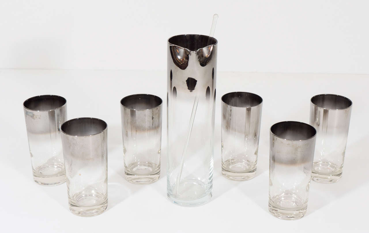 Sparkly and chic cocktail highball set with six glasses, one pitcher, and a glass swizzle stick. The pitcher and glasses are accented with a silver fade band. Dimensions below are for a typical drinking glass from the set. Please contact for