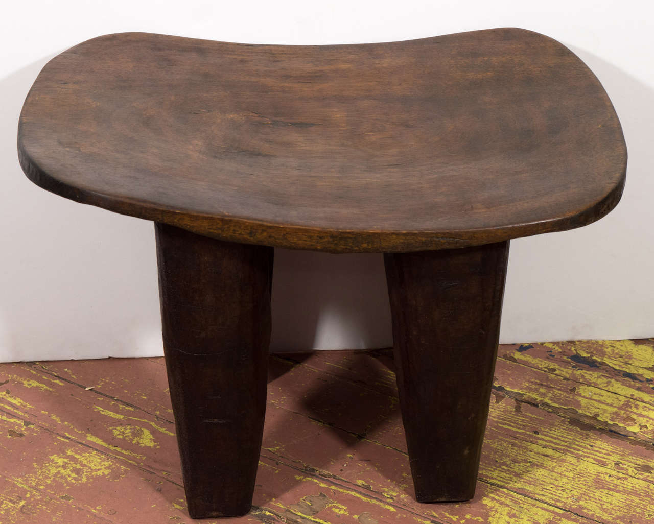 Hand carved stools made from one solid piece of wood.