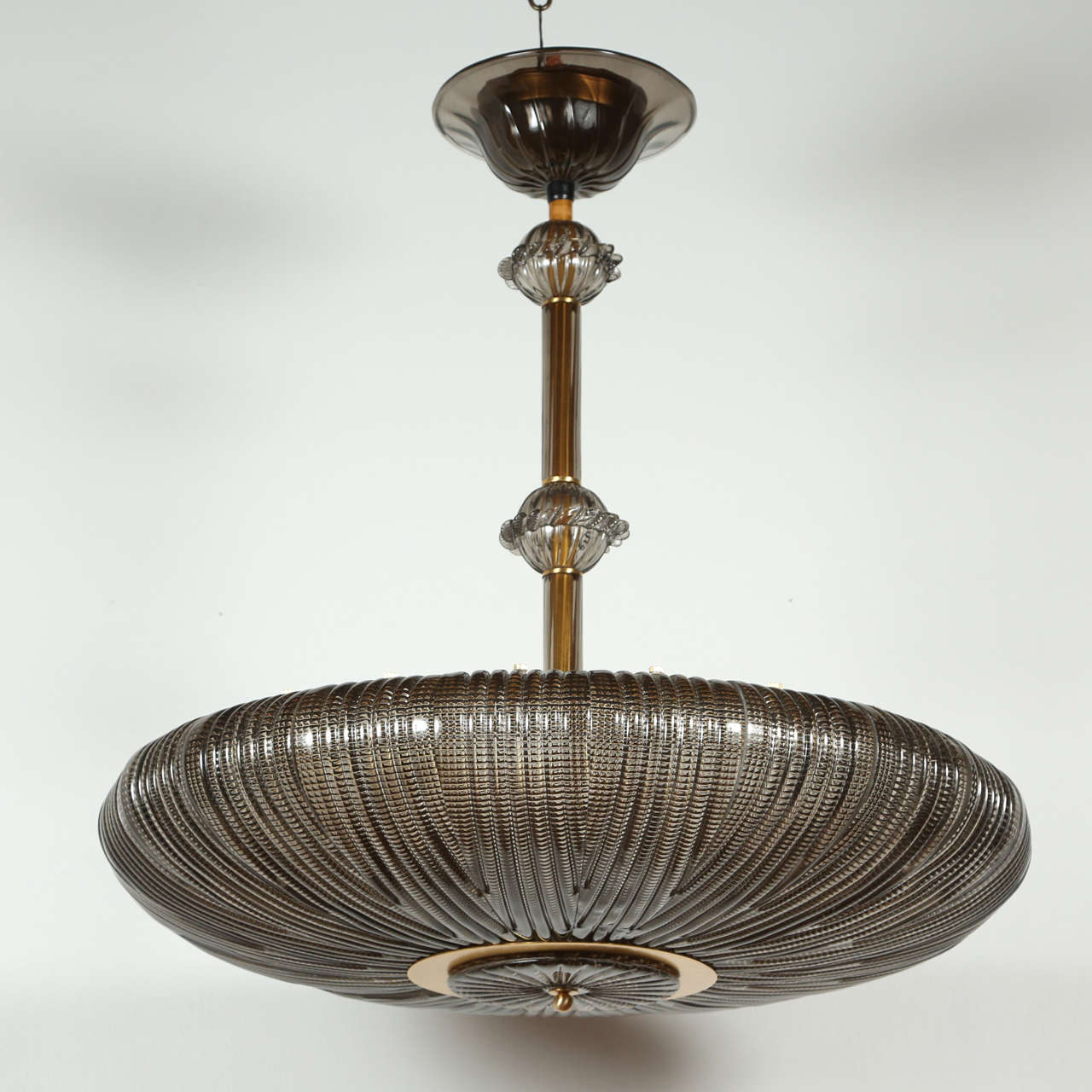 Gorgeous contemporary Murano fixture with nine standard sockets.  Each socket can take a light bulb up to 75 watts.