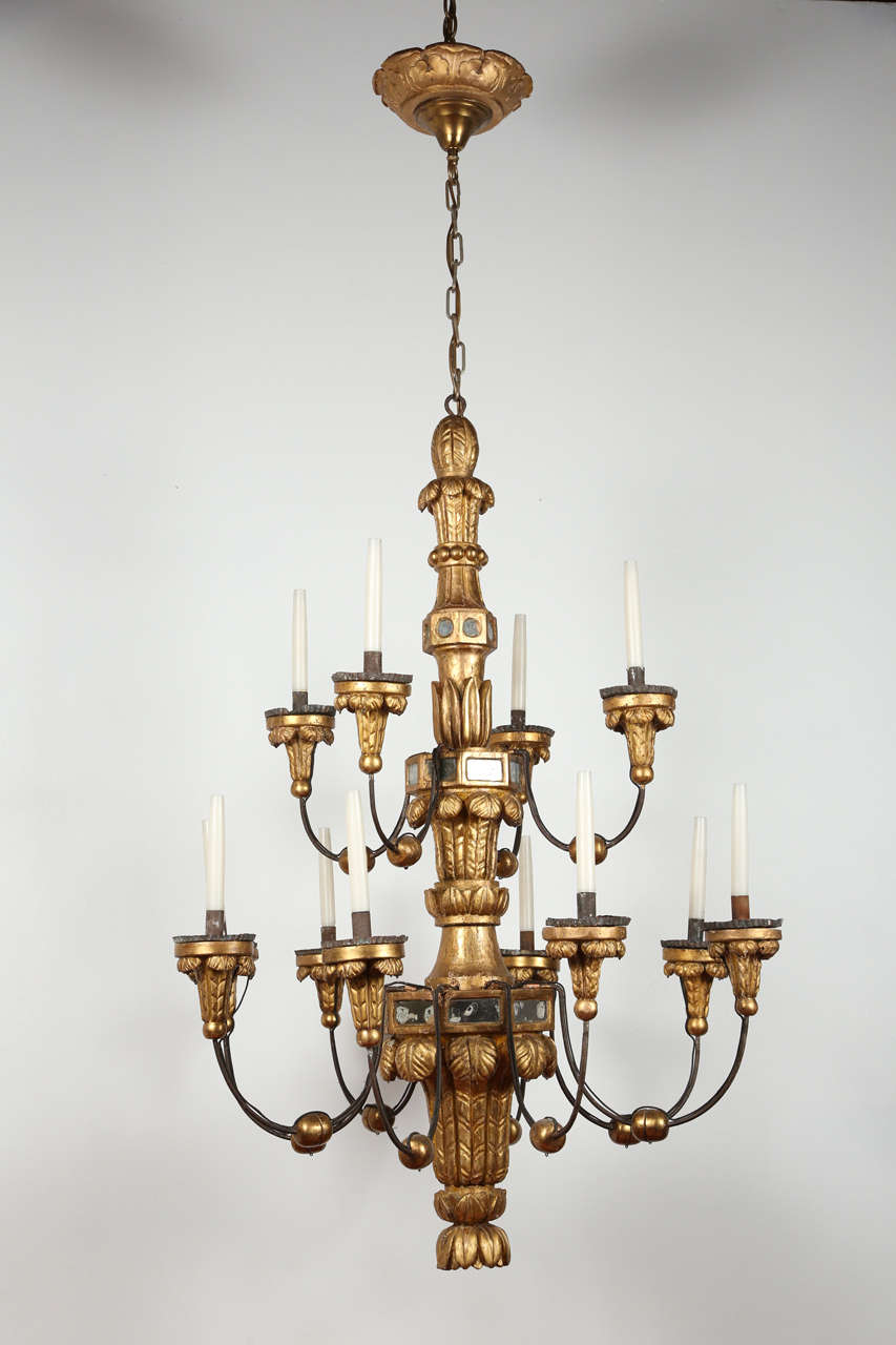 Incredible Venetian plaster fixture with iron and brass accents newly rewired for 12 candelabra bulbs; each bulb can be up to 60 watts.
