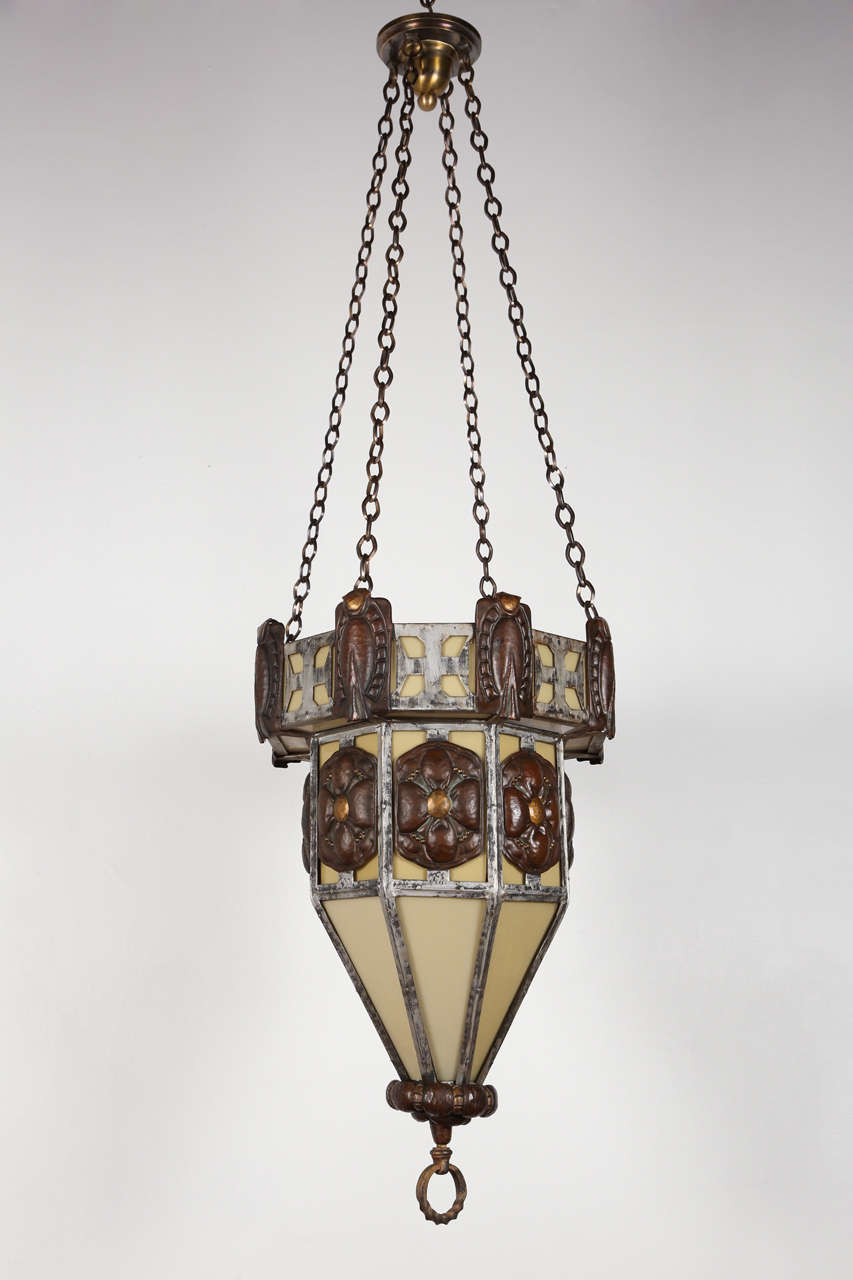 Massive fixture from a New York theater. Iron, copper, brass, glass. Excellent example of a massive Arts & Crafts pendant chandelier. Wired for a single 150-watt bulb.