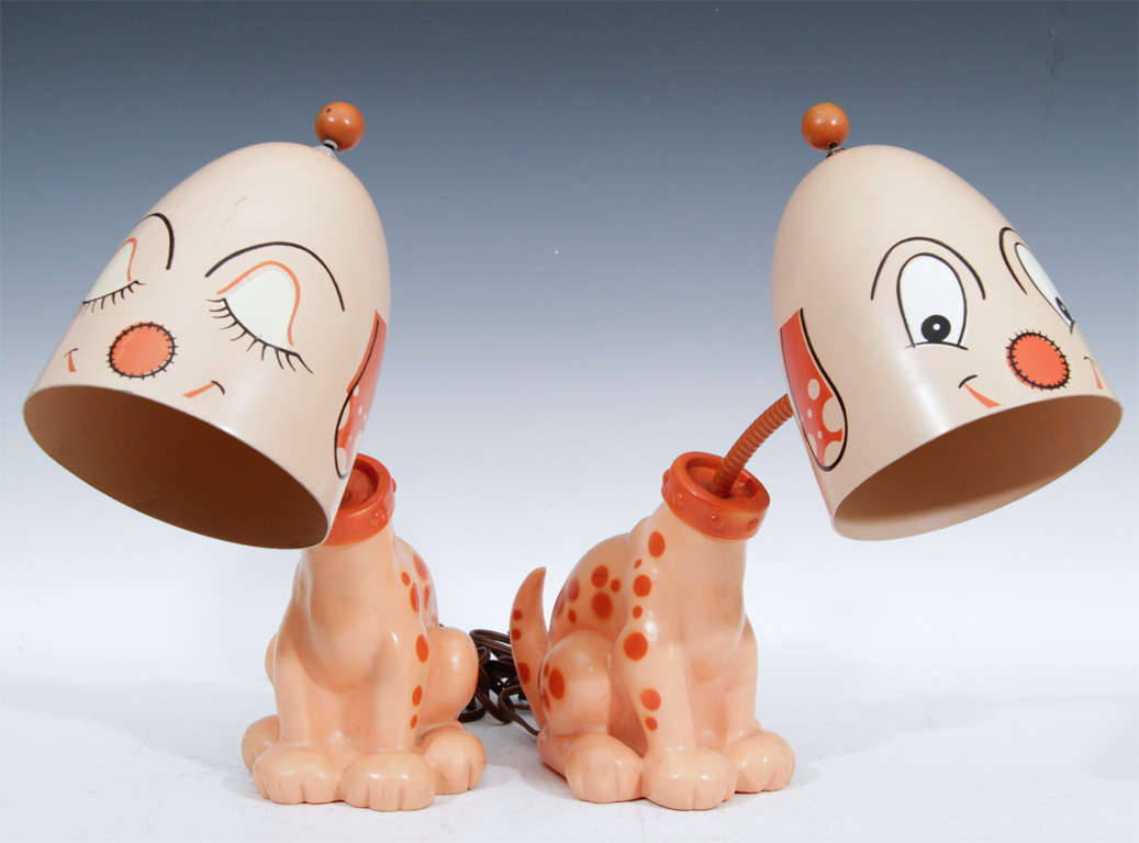 These George Nelson cartoon dog lamps with their comical cartoon faces and pastel with salmon colors are beyond cute.  A rare look at George Nelson's light side.