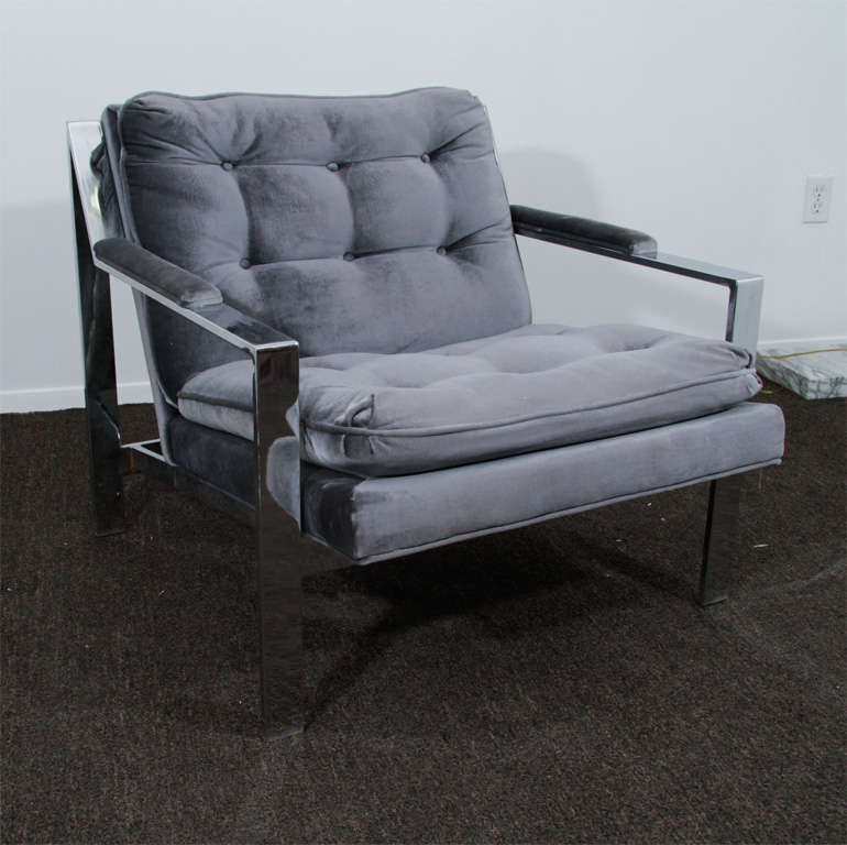 Pair of Milo Baughman Chrome Lounge Chairs with tufted grey cushions offer comfort and Milo Baughman's signature style.