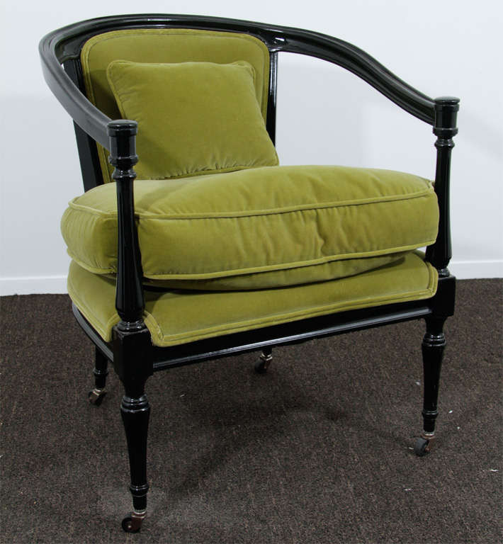 Barrel back arm chair features black lacquer hardwood frame with slender balustrade legs. Down filled seat cushion and fitted backrest upholstered in a dark lime green velvet. Elegant and versatile chair.