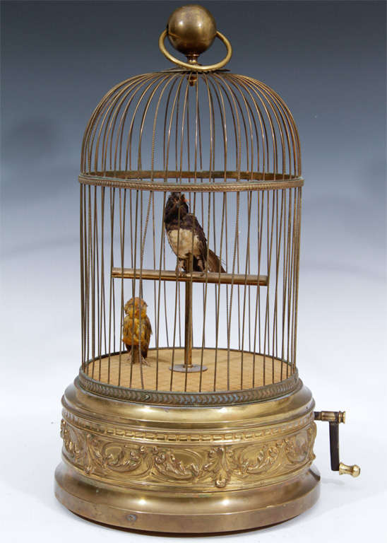 Wonderful gilt bronze musical birdcage with animated birds created in 19th Century France. Plays wonderful lilting French melody when wound. Working Condition.