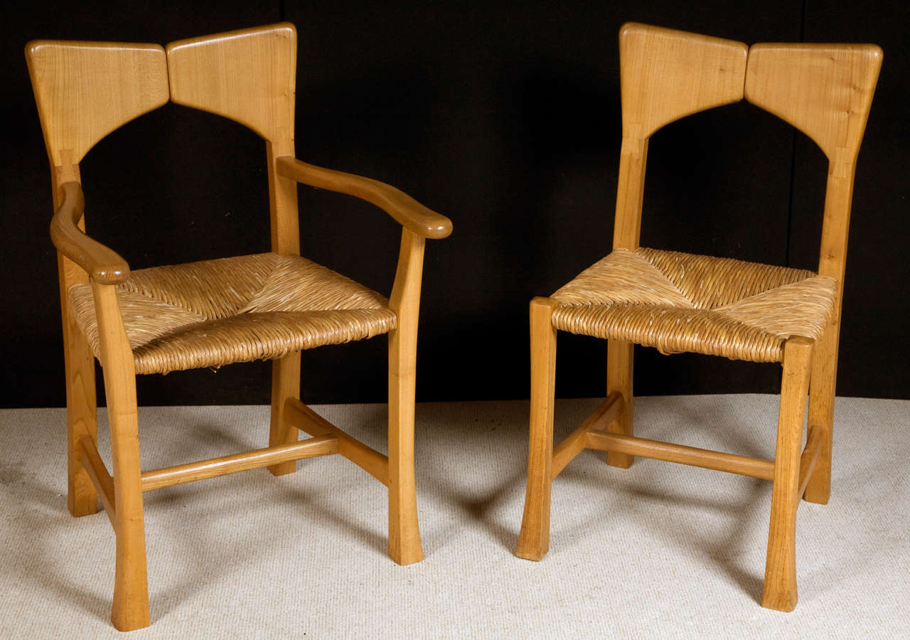 A set of eight dining chairs comprising of two carvers and six singles.
Of organic form.
Carved from Wych Elm.
Stamped butterfly to legs
England
Circa 1950-70