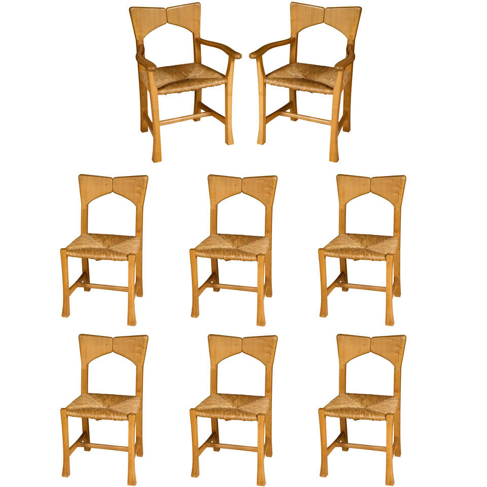 A set of eight Wych Elm dining chairs, School of Alan Peters