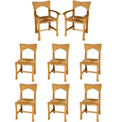 A set of eight Wych Elm dining chairs, School of Alan Peters