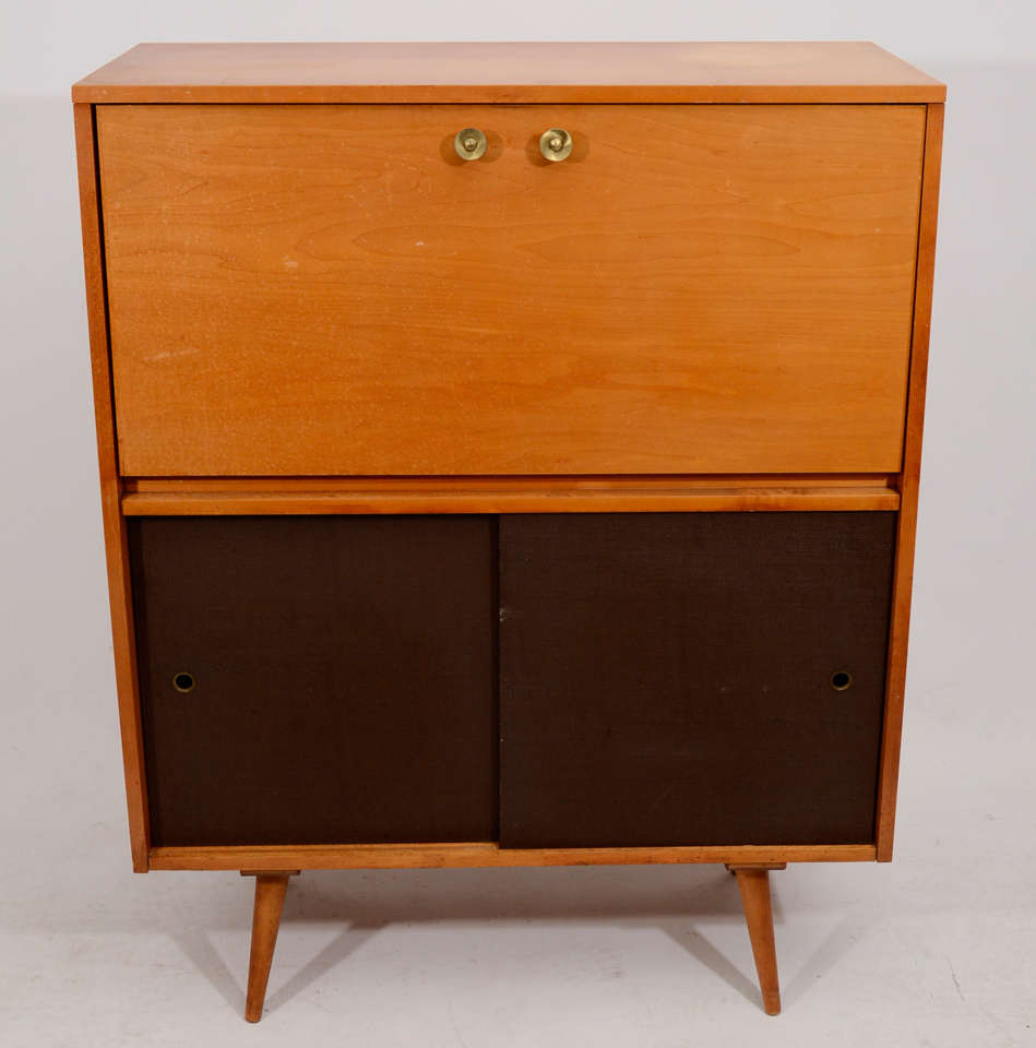 Attractive and practical secretary with a drop down desk top; a rare piece from Paul McCobb's Planner Group. Located in LV2, 113 Stanton Street, 212-358-8000.