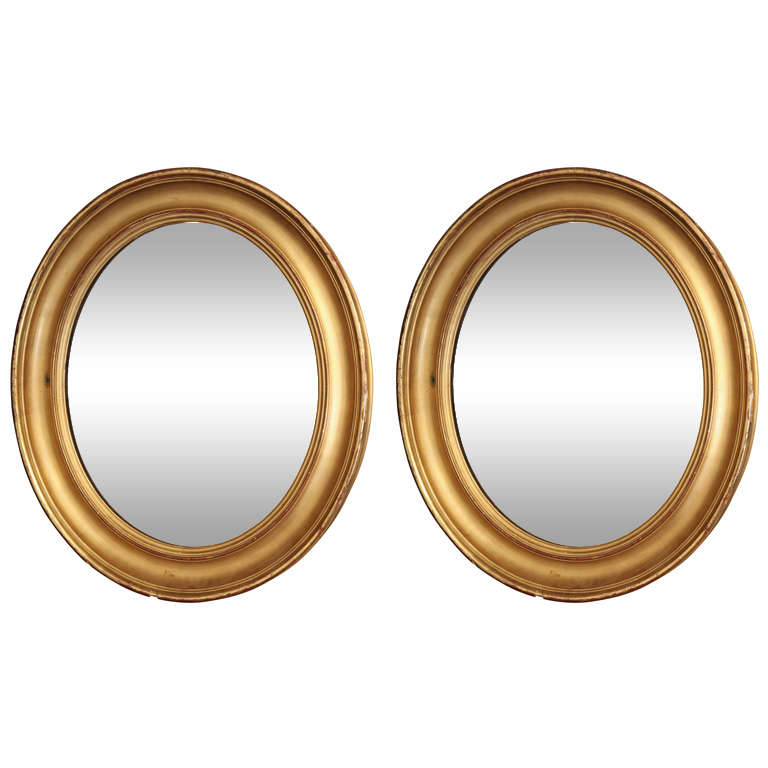 Pair of 19th Century Oval Gilt Mirrors
