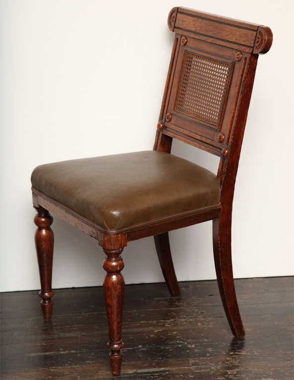 Set of 14 George IV oak dining chairs, England, circa 1825. Design attributed to Richard Bridgens for George Bullock. Maker G. Bryson.